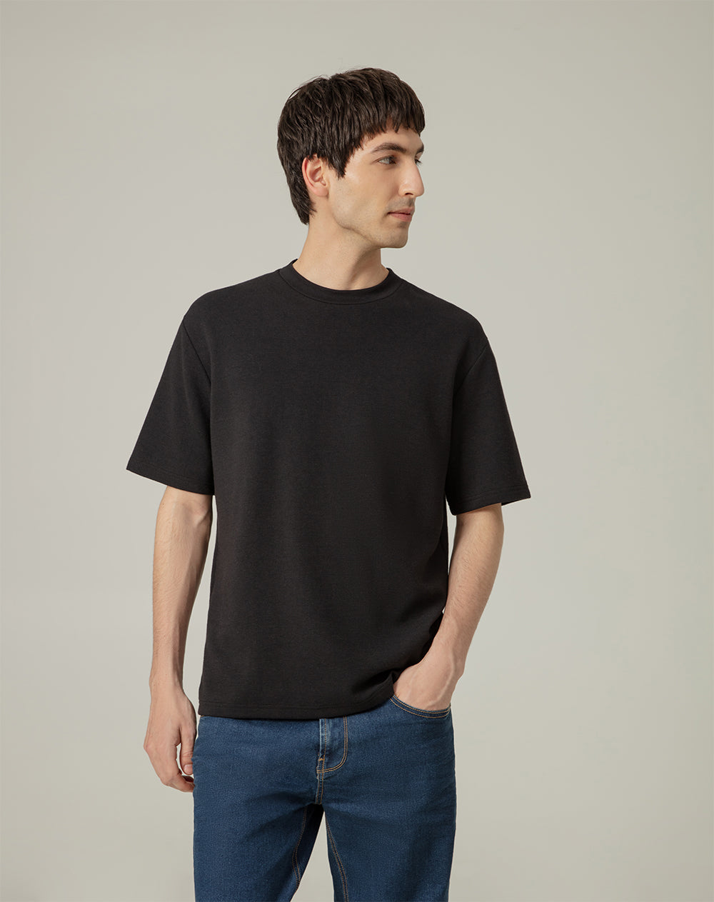 Camiseta oversized fit en tela con textura manga corta negra